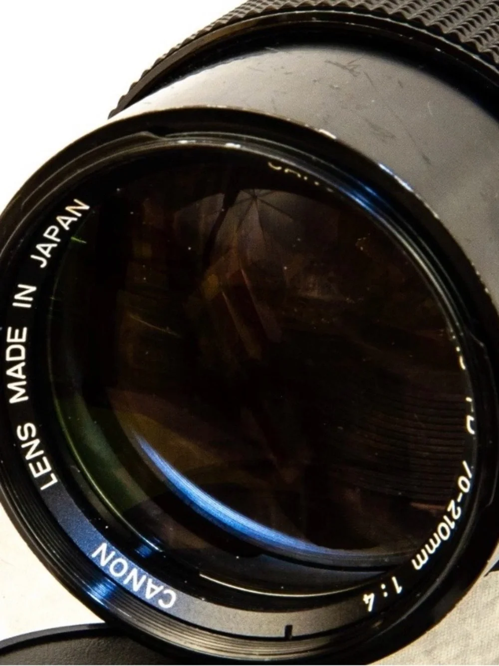 Canon silver and black AE-1 with 50mm f/1.4 and 70-210mm lenses